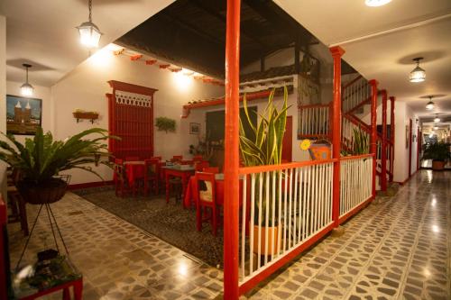 a restaurant with a table and chairs in a room at Hotel La Casona in Jardin