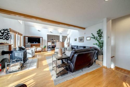 a living room with a couch and a fireplace at Mountain Luxury - Hot Tub Amazing Views & More in Harpers Ferry