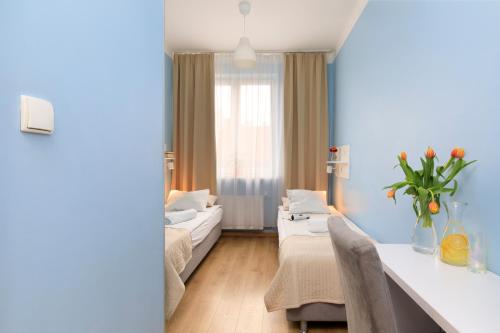 a living room with a couch and a table at Freedom Hostel in Kraków