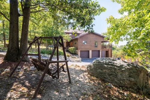 a playground in front of a house at Mountain Luxury - Hot Tub Amazing Views & More in Harpers Ferry