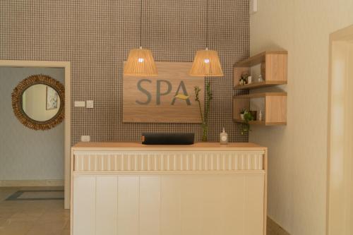 a spa counter with two pendant lights above it at Bahia Principe Luxury Ambar - Adults Only All Inclusive in Punta Cana