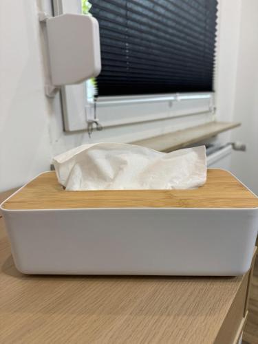 a white box on a table with a window at Mahesars Home in Gevelsberg