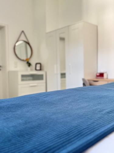 a close up of a blue bed in a room at Mahesars Home in Gevelsberg
