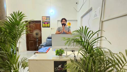 a man taking a picture of himself in a mirror at Elephant House Boutique Stays- BHU- BLW in Varanasi