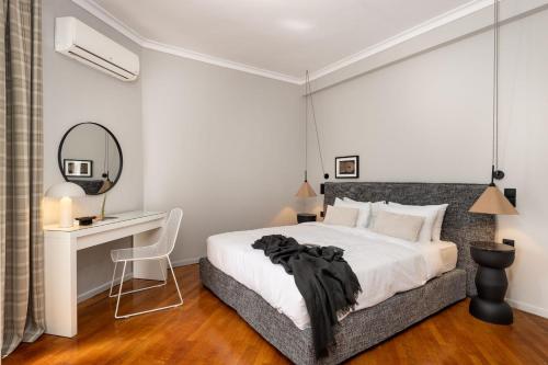 Ένα ή περισσότερα κρεβάτια σε δωμάτιο στο The Apartment 09