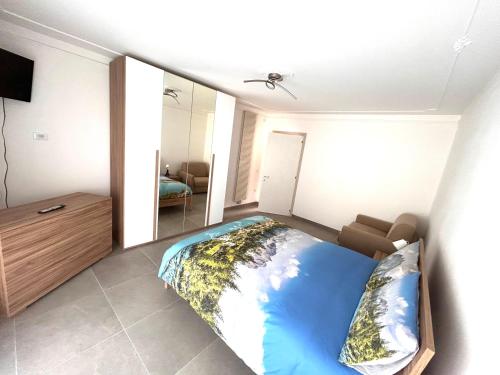 Postel nebo postele na pokoji v ubytování Fornaci Lodge
