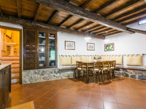 a dining room with a table and chairs at Holiday Home Bellavista - Villi by Interhome in Montieri