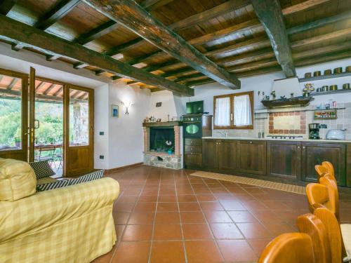 a living room with a couch and a fireplace at Holiday Home Bellavista - Villi by Interhome in Montieri