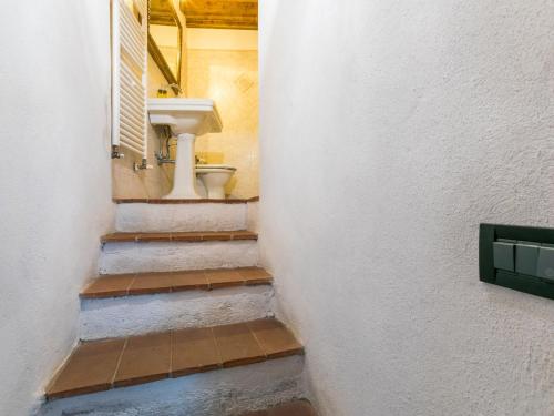 a bathroom with a sink and a toilet at Holiday Home Bellavista - Villi by Interhome in Montieri