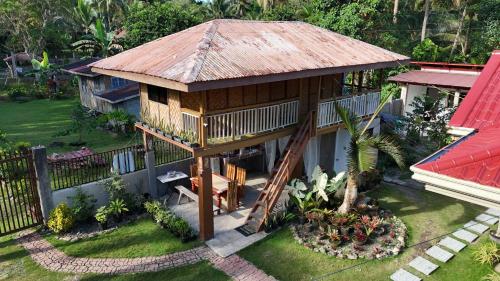 an aerial view of a house with a roof at Khloe Serenity Guest House in Batuan