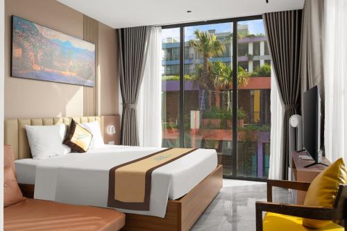 Postel nebo postele na pokoji v ubytování Khue Le Bleu Villa - Hải Tiến