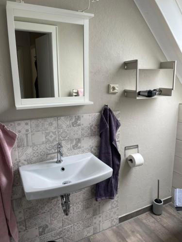 Ένα μπάνιο στο Ferienwohnung Likedeeler