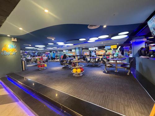 a bowling alley with people playing a game at Gold Coast Apartment Seaview in Nha Trang