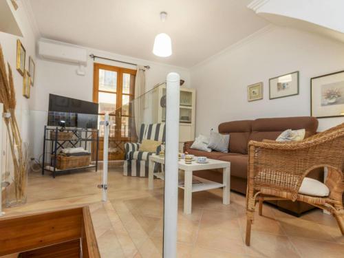 a living room with a couch and a table at Holiday Home Corazón de Vinaròs by Interhome in Vinaròs