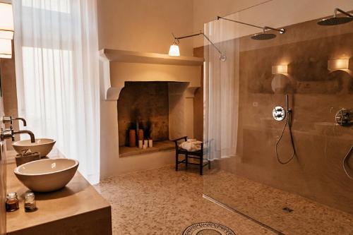 a bathroom with a shower and a sink and a toilet at Palazzo Pati in Tiggiano