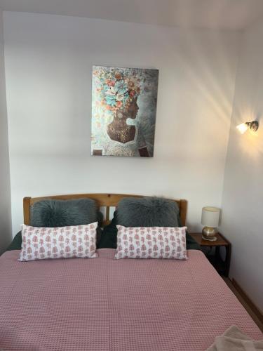 Postel nebo postele na pokoji v ubytování Relaxxa Apartman