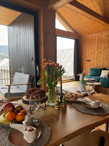 a wooden table with food on top of it at Chalet Smreky in Telgárt
