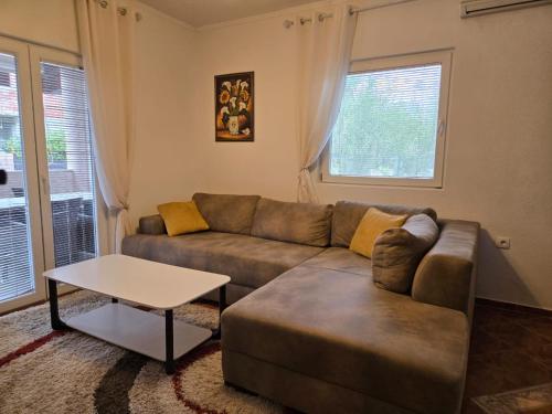 a living room with a couch and a table at Apartment Anna in Polje