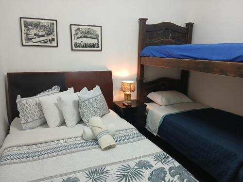 Postel nebo postele na pokoji v ubytování Hostal Hanoi en Bogotá