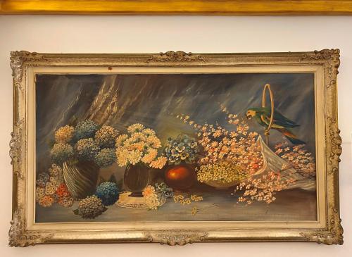 a painting of flowers and fruit on a wall at Suite-Regia Domus in Sovereto