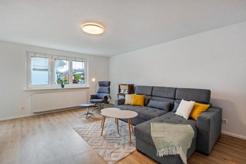 a living room with a couch and a table at Ferienwohnung K5 in Wehr