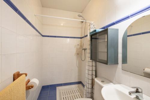 a bathroom with a sink and a toilet at Cal Panxeta in Balsareny