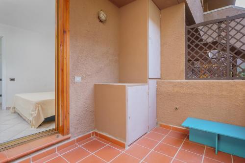 a room with a mirror and a table and a bed at Casa Smeralda By Anthimea in Cugnana Verde