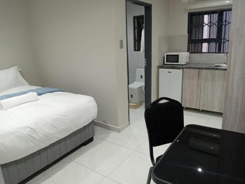Kuchyň nebo kuchyňský kout v ubytování Hayat Hotel 94Juta