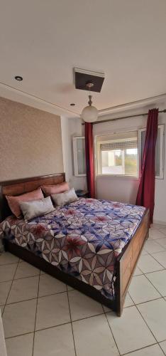 Postel nebo postele na pokoji v ubytování Appartement saidia