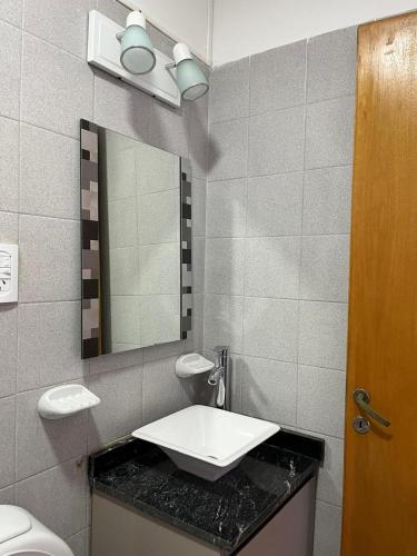 a bathroom with a sink and a mirror at Dilans in San Luis