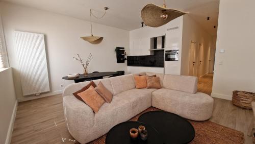 a living room with a couch and a table at Belle Plage in Blankenberge