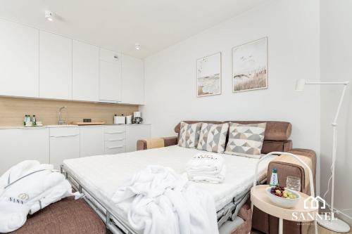 Voodi või voodid majutusasutuse Apartament Sands z dostępem do basenów,saun,jacuzzi - Pinea Apartments Pobierowo-SANNEL Apartments for rent toas