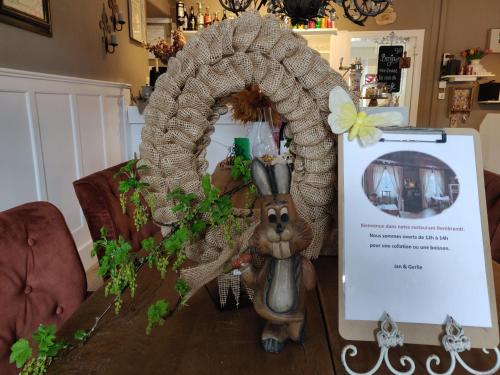 a table with a figurine of a rabbit on it at Auberge de La Chaloire in La Petite-Verrière