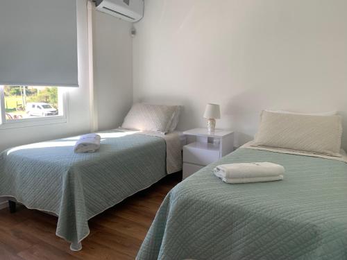 Giường trong phòng chung tại Vista24uy Ref1007