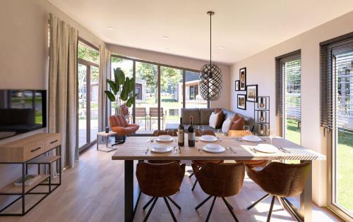 a dining room and living room with a table and chairs at Cozy beach cottage Enkhuizen near the lake in Enkhuizen