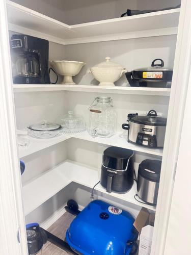 a pantry filled with lots of dishes and appliances at Premier Luxe Villa in Weslaco
