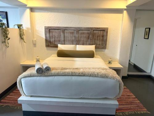 Ein Bett oder Betten in einem Zimmer der Unterkunft OPE Suites Usaquen