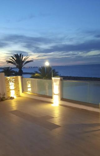 a night view of a patio with lights at Appartement vue sur mer à Mahdia in Mahdia