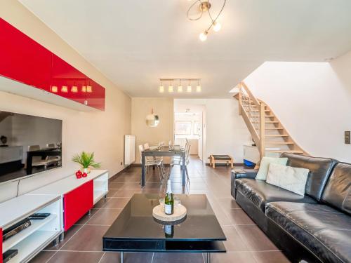 a living room with a couch and a table at Apartment Ter Duyne by Interhome in Bredene