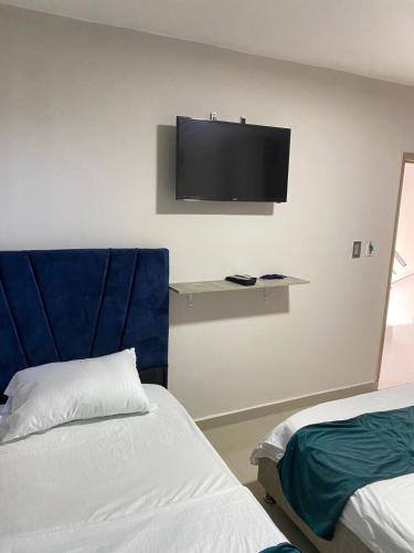Postel nebo postele na pokoji v ubytování Hotel GRAND H RODADERO