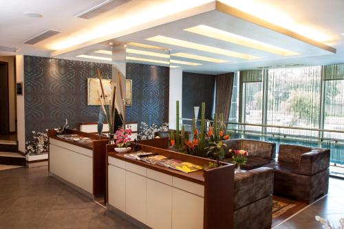 a lobby with a reception desk in a building at Blanca Hotel in Izmir