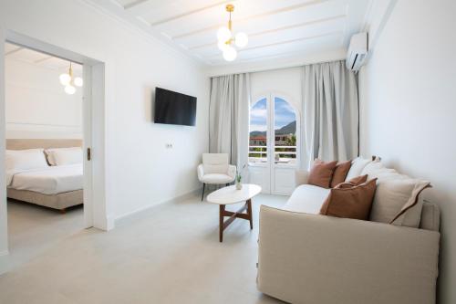 Ένα ή περισσότερα κρεβάτια σε δωμάτιο στο Lefko Hotel & Apartments
