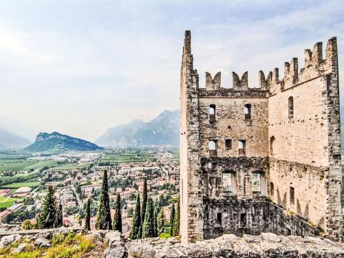an old castle with a view of a city at Apartment Calicantus by Interhome in Dro