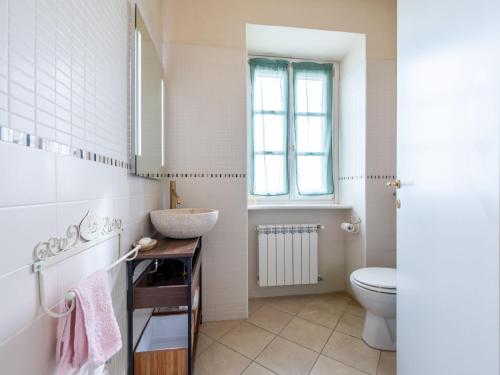 a bathroom with a sink and a toilet at Apartment La Bordona by Interhome in Vignale Monferrato