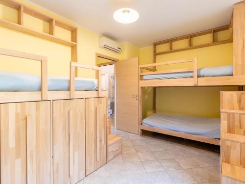 a room with four bunk beds in it at Apartment Casa Rita by Interhome in Civezza