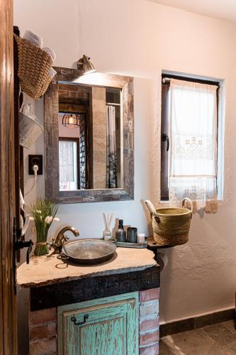 a bathroom with a sink and a mirror at Вила Китна in Lozno