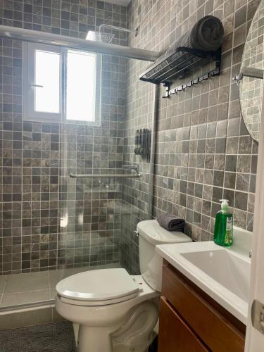 a bathroom with a toilet and a sink at New! Lovely and spacious, 2 Ocean view terraces in El Suazal