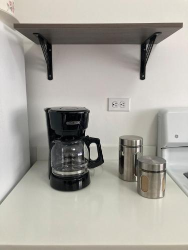 a coffee maker sitting on a counter in a kitchen at New! Lovely and spacious, 2 Ocean view terraces in El Suazal