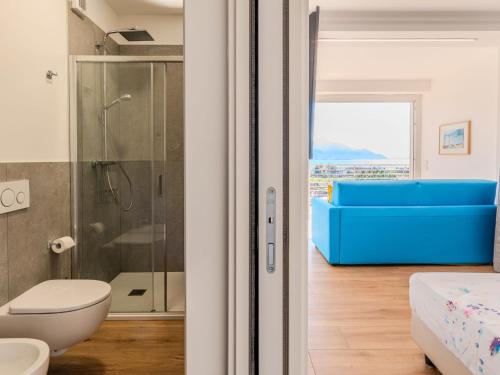 a bathroom with a shower and a toilet and a tub at Apartment Agone by Interhome in Consiglio di Rumo