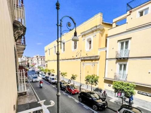 a street with cars parked on a city street at Apartment Il Balconcino di Sorrento by Interhome in Sorrento